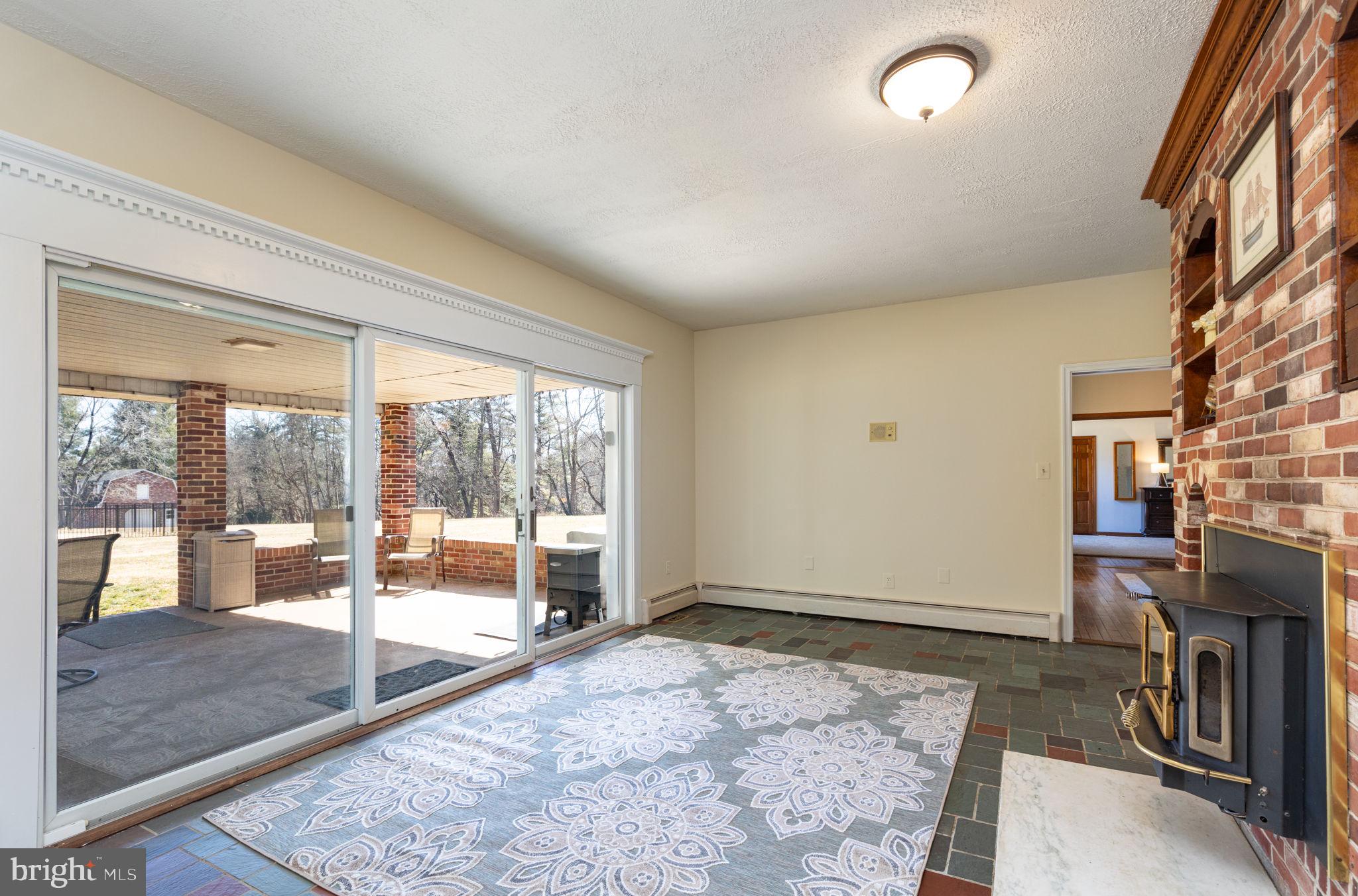 13827 Bottom Road Hydes, MD 21082 - Photo 25 of 57 Den with Fireplace