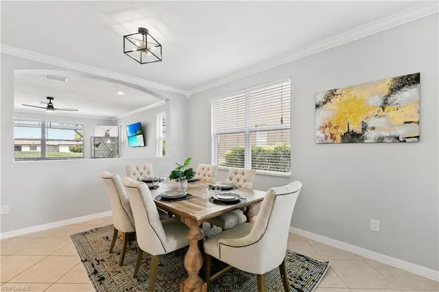 a dining room with furniture and window