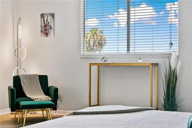 a bedroom with furniture and window