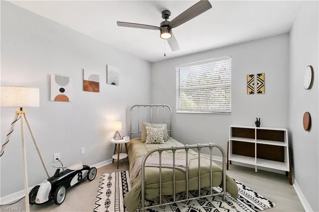 a bathroom with double vanity sinks a toilet a mirror and shower