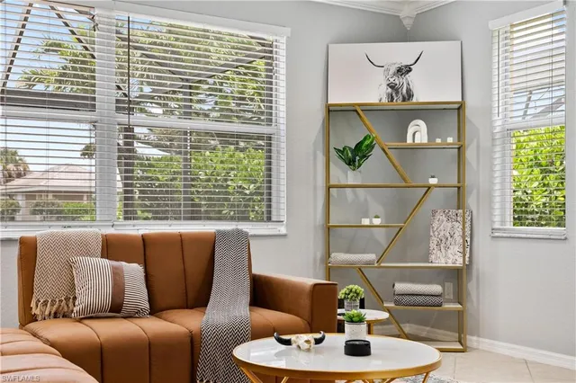 a living room with furniture and a window
