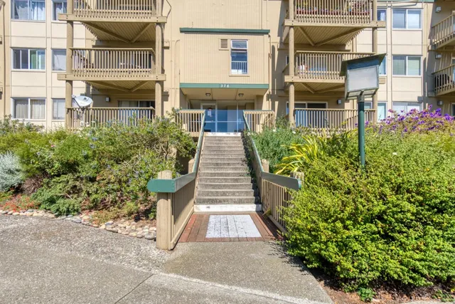 a view of a brick building with many windows
