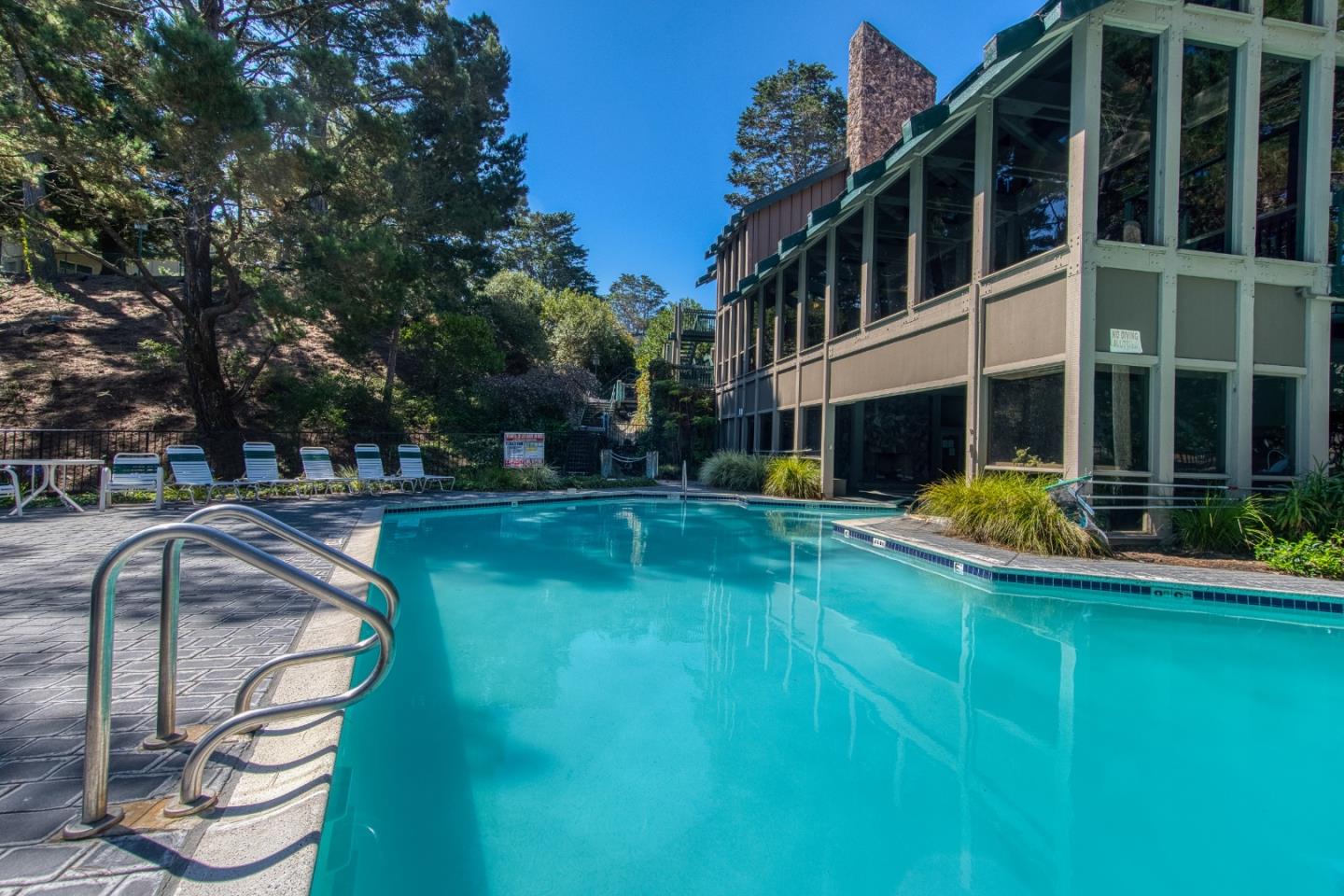 376 Imperial Way, Unit 315 Daly City, CA 94015 - Photo 29 of 29 a view of a swimming pool with a bench and trees around