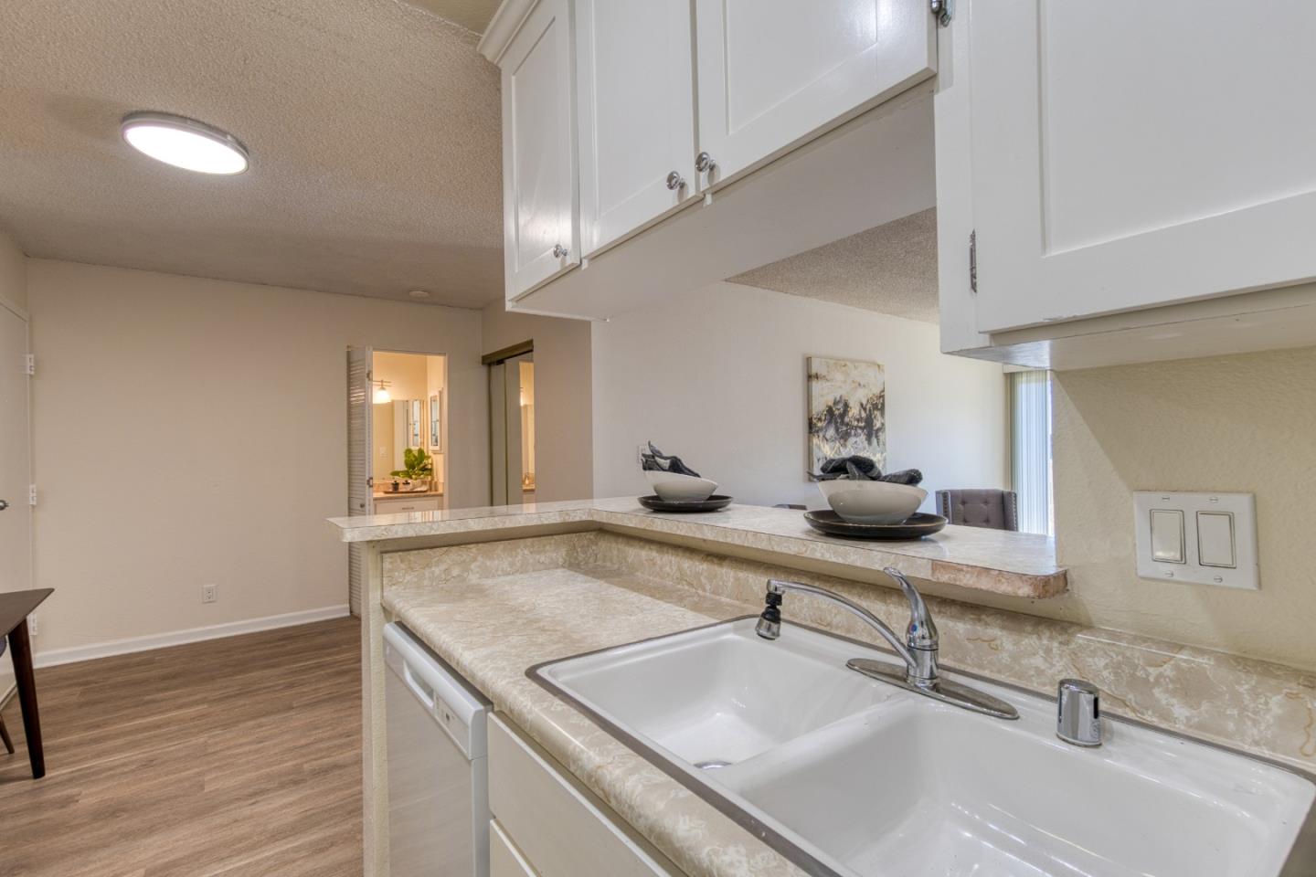 376 Imperial Way, Unit 315 Daly City, CA 94015 - Photo 5 of 29 a bathroom with double vanity and a mirror