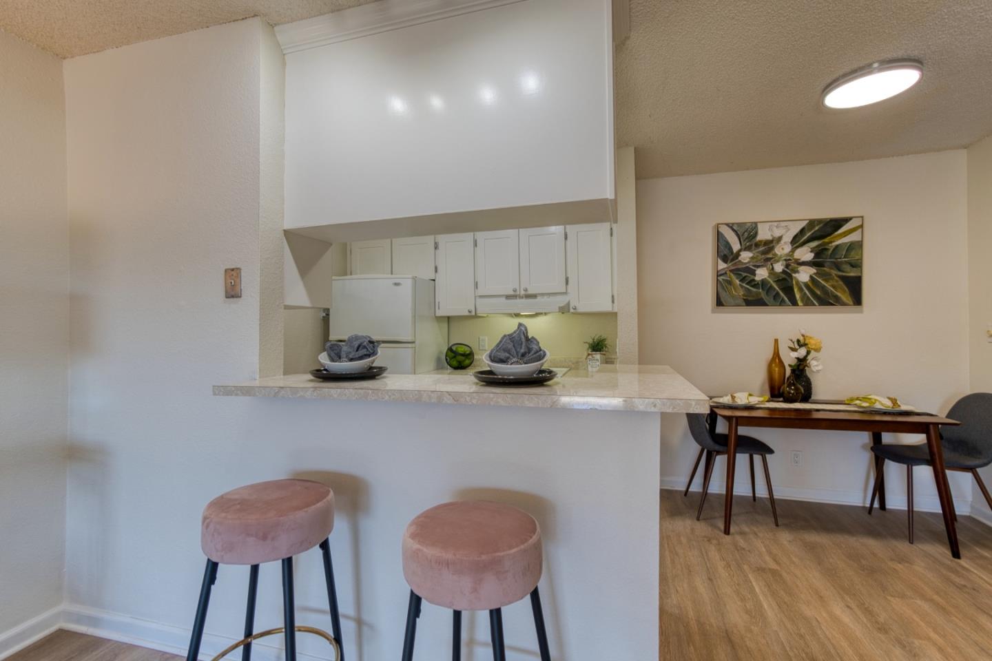376 Imperial Way, Unit 315 Daly City, CA 94015 - Photo 7 of 29 a view of a dining room with furniture and wooden floor