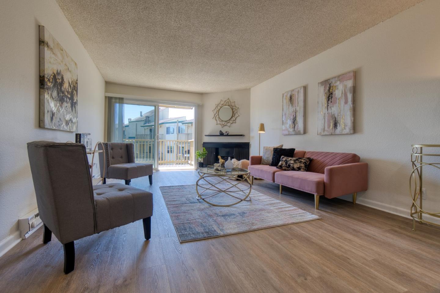 376 Imperial Way, Unit 315 Daly City, CA 94015 - Photo 10 of 29 a living room with furniture and a fireplace