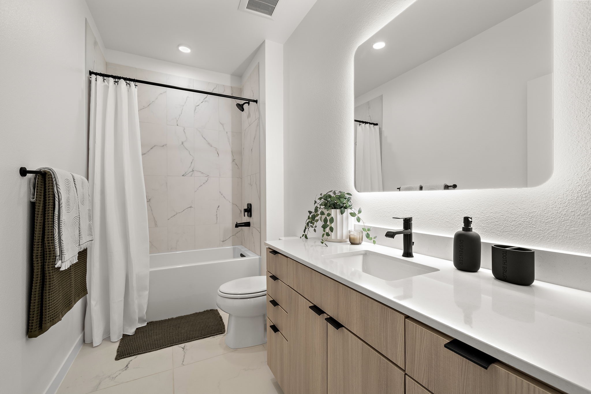 1941 Sawdust Road, Unit 120 The Woodlands, TX 77380 - Photo 26 of 38 a bathroom with a double vanity sink toilet and shower
