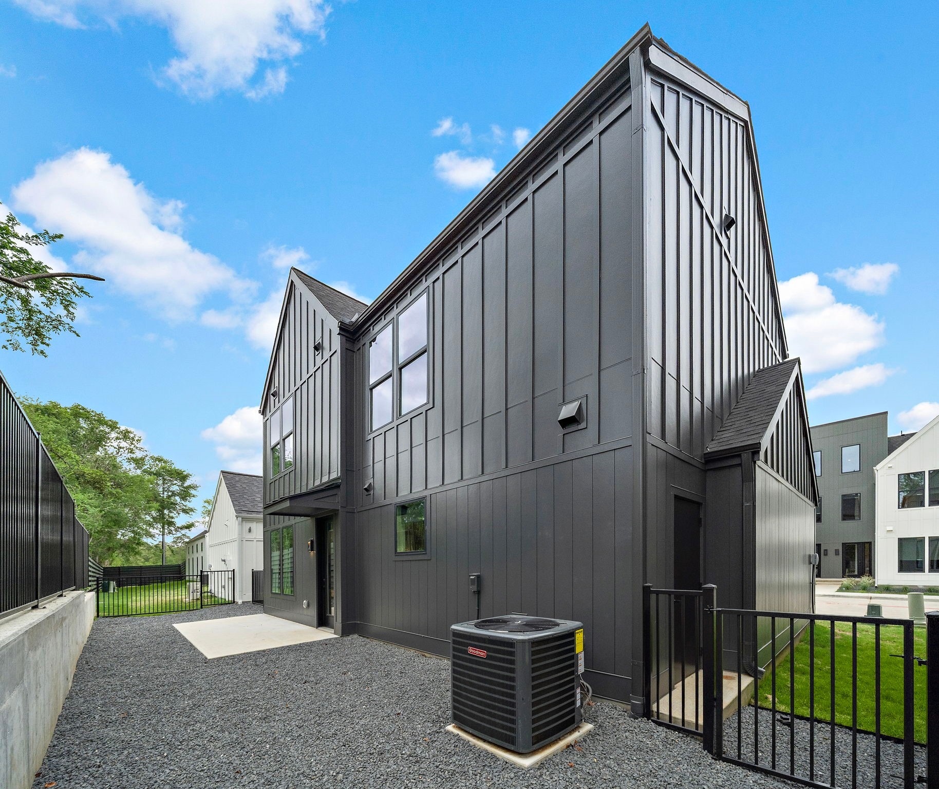 1941 Sawdust Road, Unit 120 The Woodlands, TX 77380 - Photo 5 of 38 a view of a house with a wooden fence