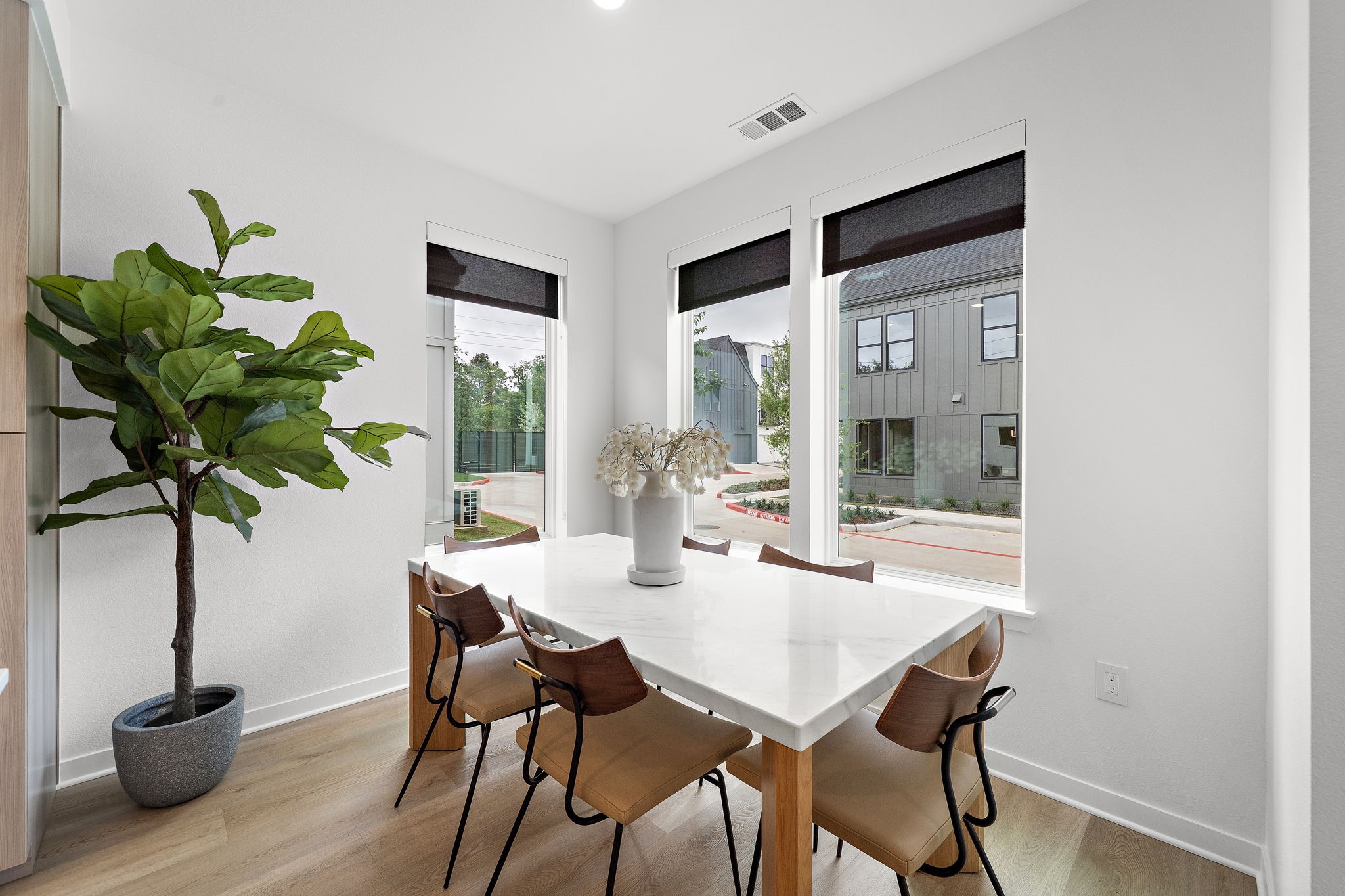 1941 Sawdust Road, Unit 120 The Woodlands, TX 77380 - Photo 8 of 38 a dining room with furniture and potted plants