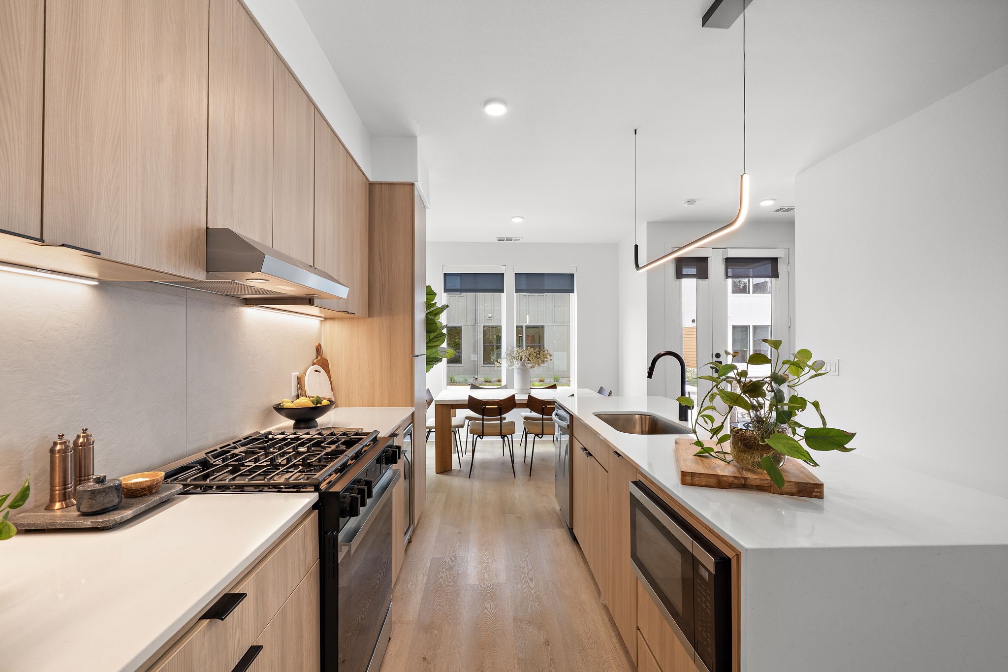 1941 Sawdust Road, Unit 120 The Woodlands, TX 77380 - Photo 10 of 38 a kitchen with sink stove and cabinets