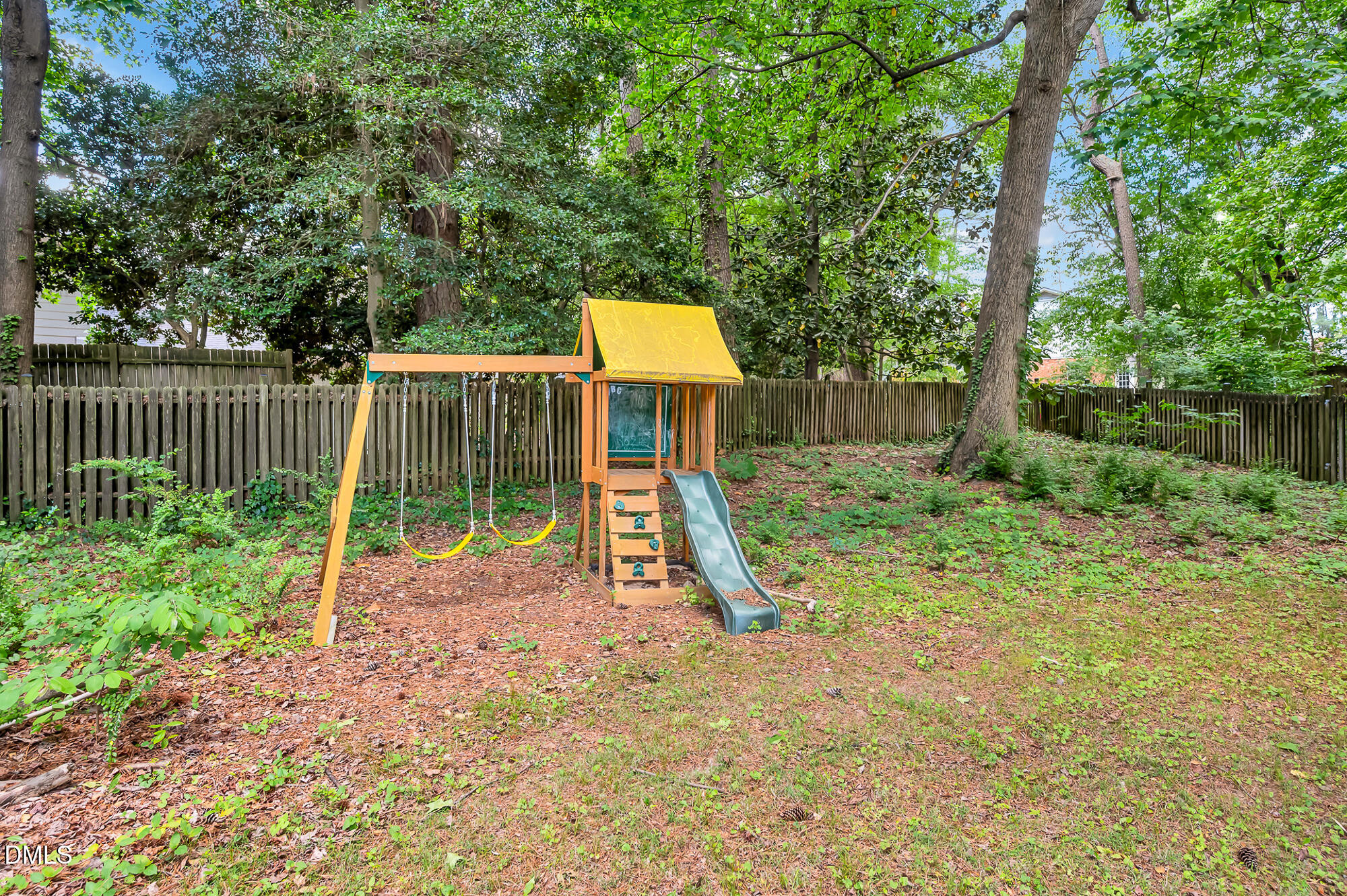 7500 Drayton Court Raleigh, NC 27615 - Photo 24 of 27 a view of a house with a backyard