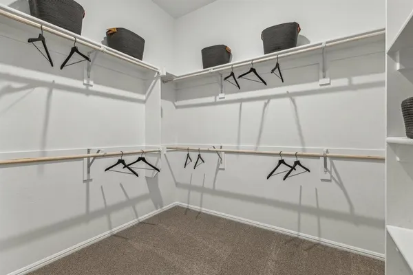 a bedroom with bed and a window