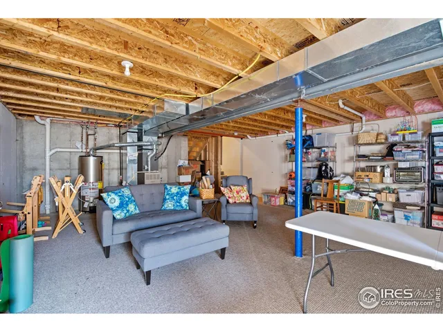 a building outdoor space with patio furniture and potted plants