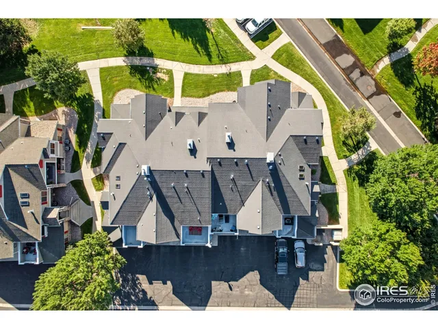 an aerial view of a house with swimming pool and outdoor space