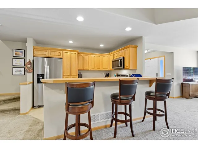 a kitchen with a table and chairs in it