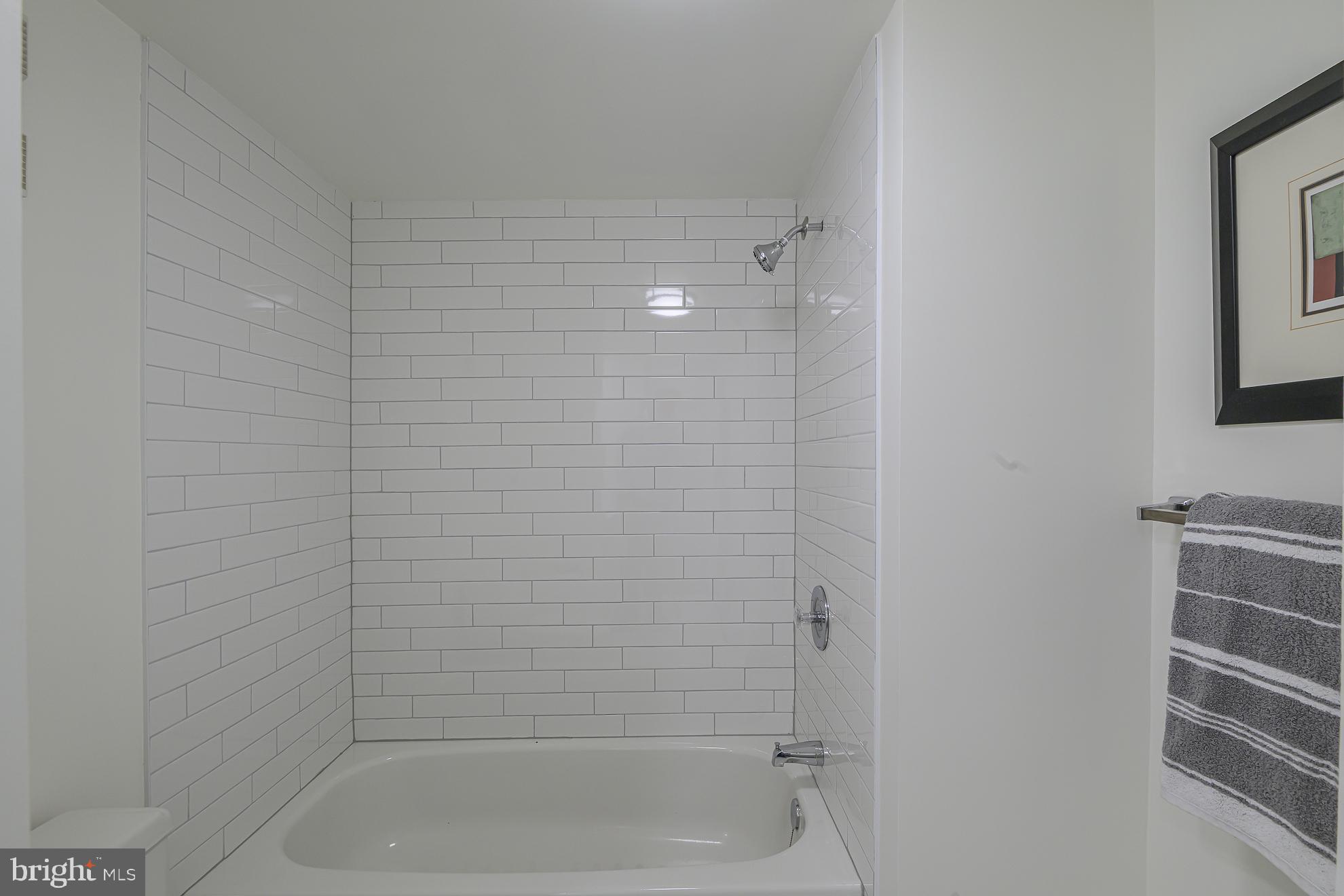 1016 South Wayne Street, Unit 604 Arlington, VA 22204 - Photo 29 of 42 a bathroom with a shower