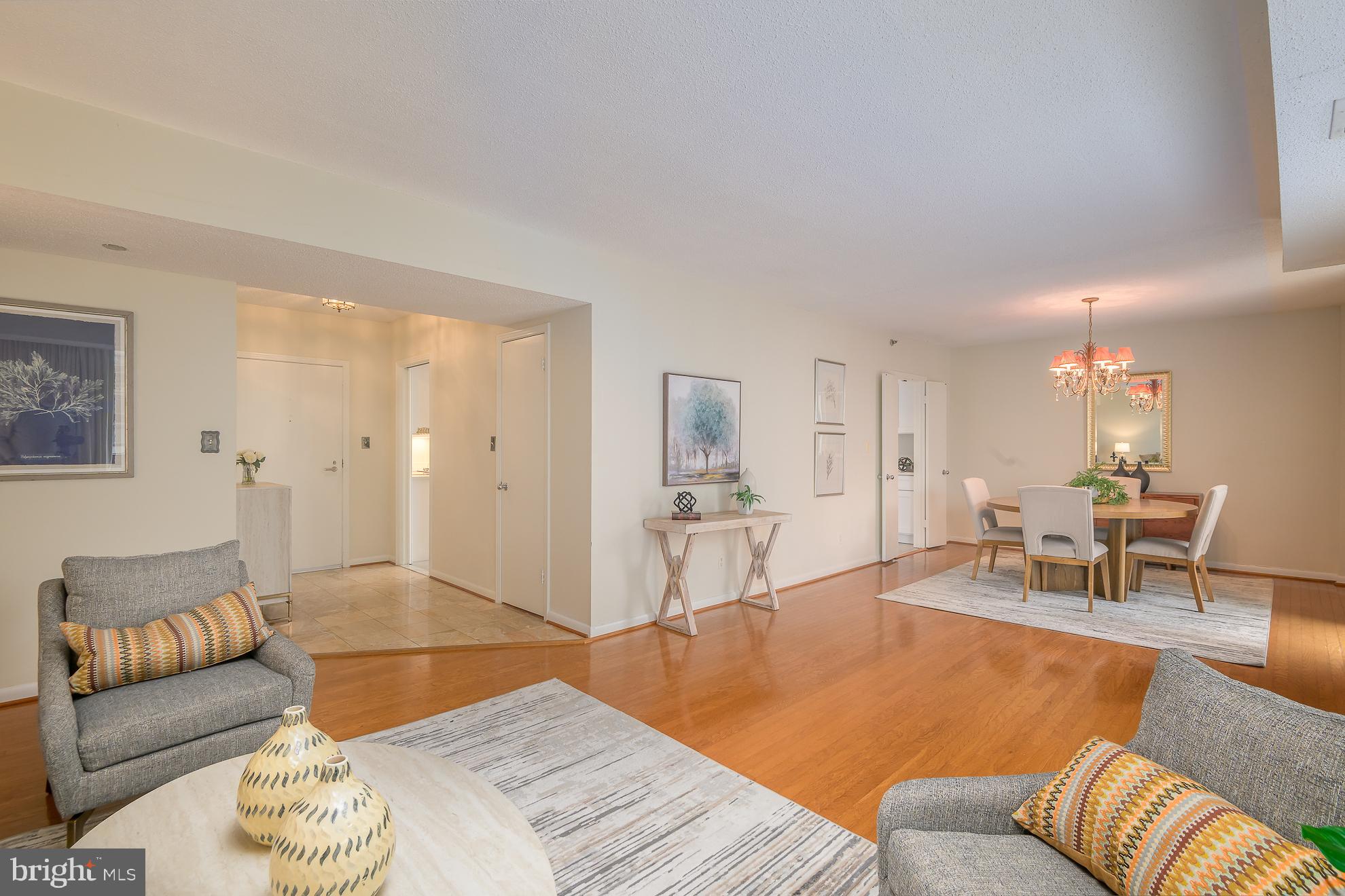 1016 South Wayne Street, Unit 604 Arlington, VA 22204 - Photo 6 of 42 a living room with furniture and wooden floor