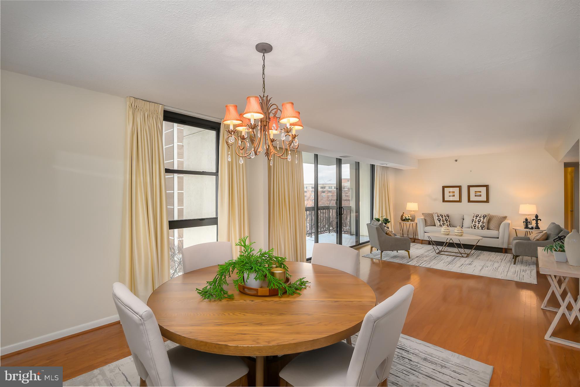 1016 South Wayne Street, Unit 604 Arlington, VA 22204 - Photo 10 of 42 a view of a dining room with furniture and wooden floor