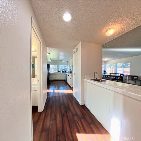a view of living room with furniture and wooden floor