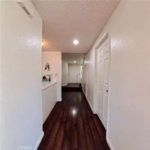 a view of gallery with wooden floor