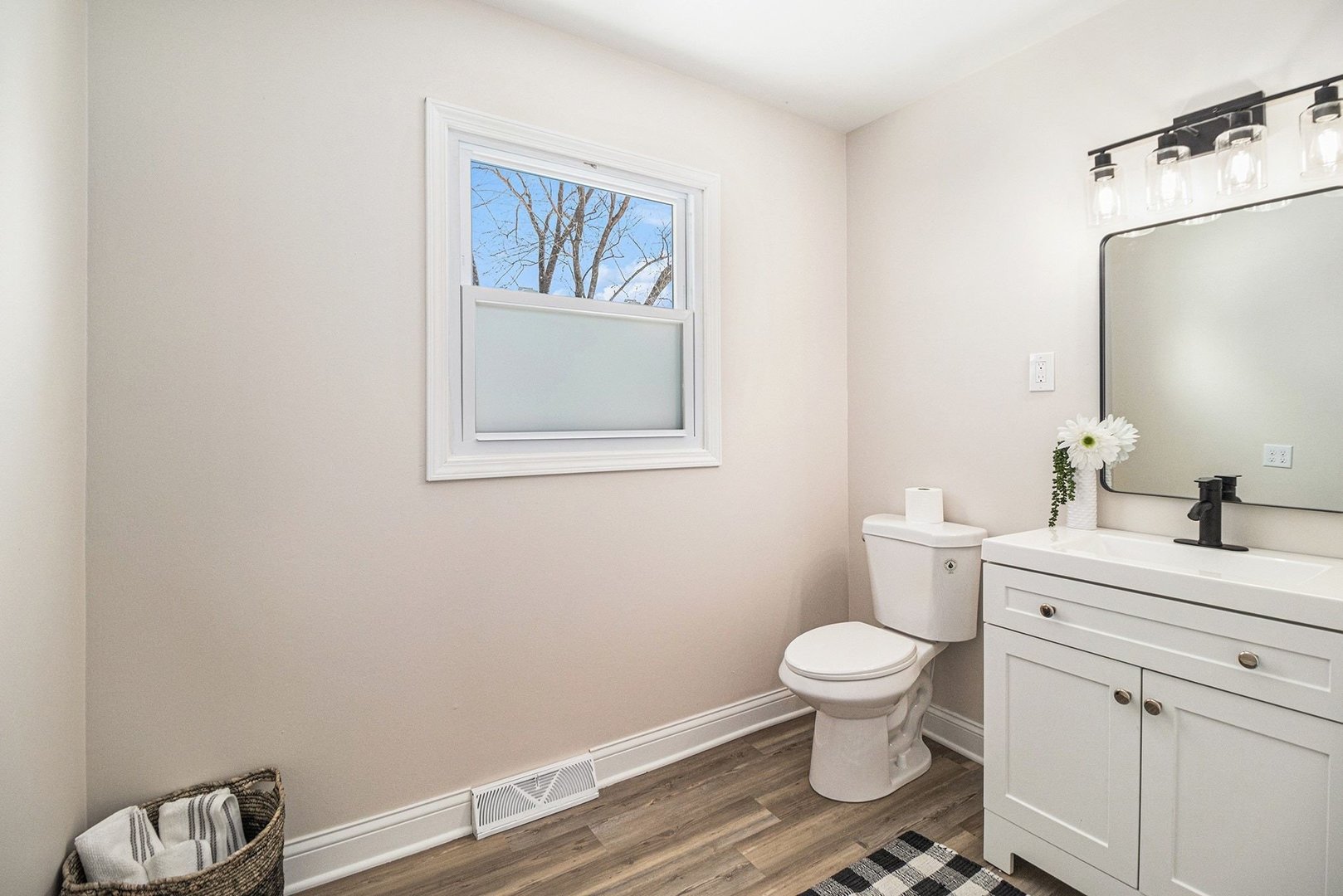18947 Ridgewood Avenue Lansing, IL 60438 - Photo 15 of 21 a bathroom with a toilet a sink and mirror