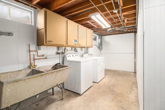 a kitchen with a sink and a refrigerator