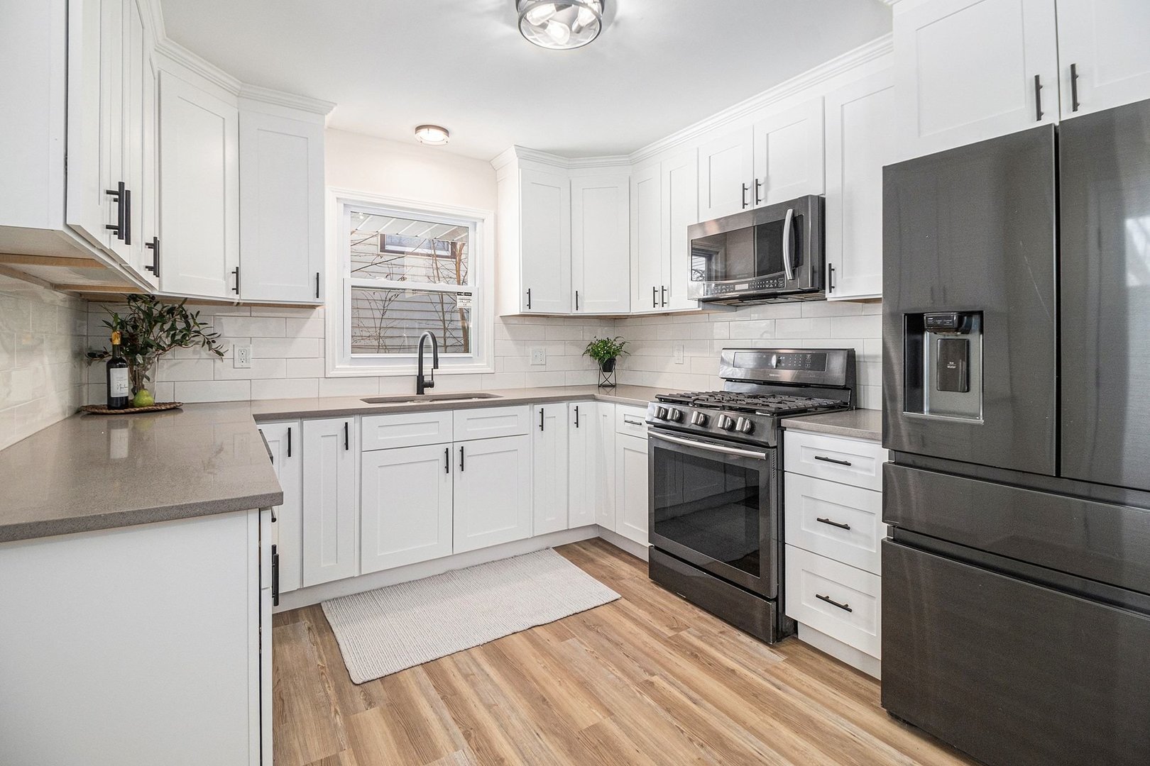 18947 Ridgewood Avenue Lansing, IL 60438 - Photo 7 of 21 a kitchen with cabinets stainless steel appliances and a counter space