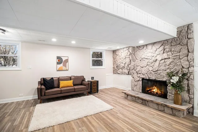 a living room with furniture and a fireplace