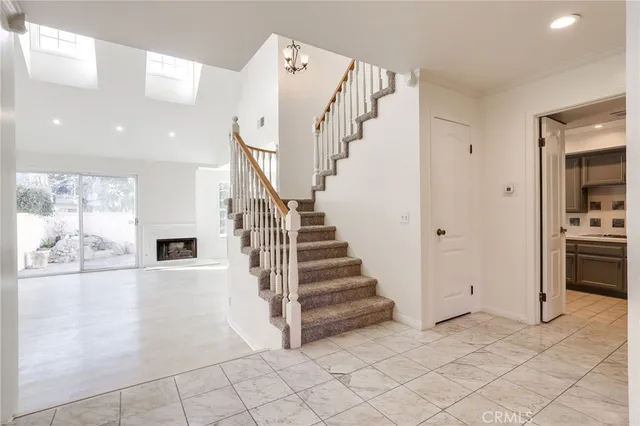 a view of entryway and hall with a living room
