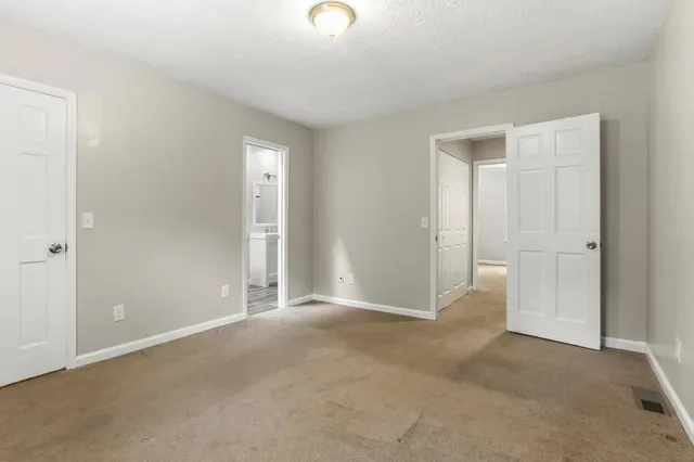 a view of an empty room and window