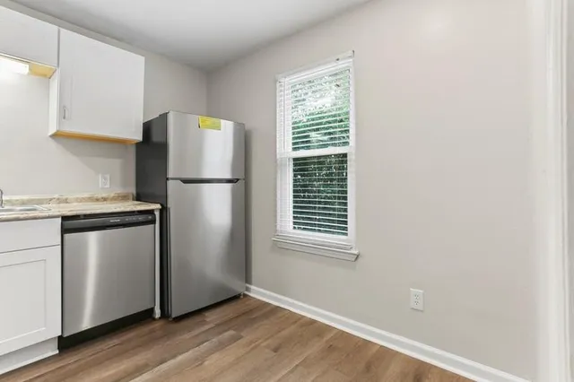 a white refrigerator freezer sitting in a kitchen