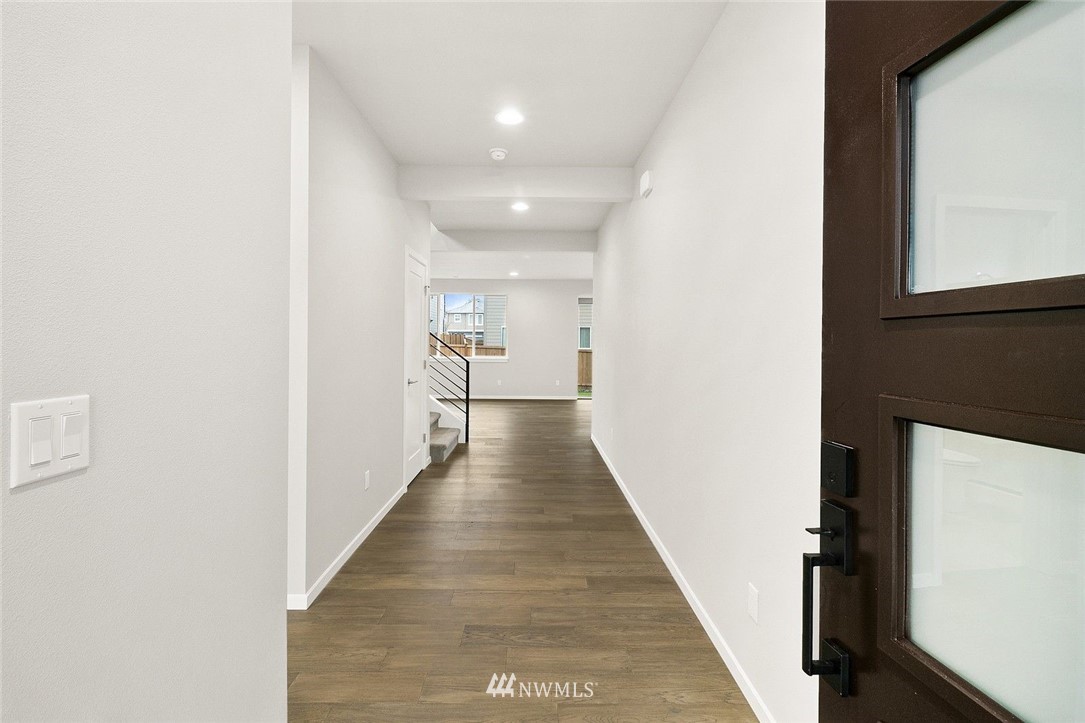 26832 102nd Place Southeast Kent, WA 98030 - Photo 2 of 31 a view of a hallway with wooden floor and staircase