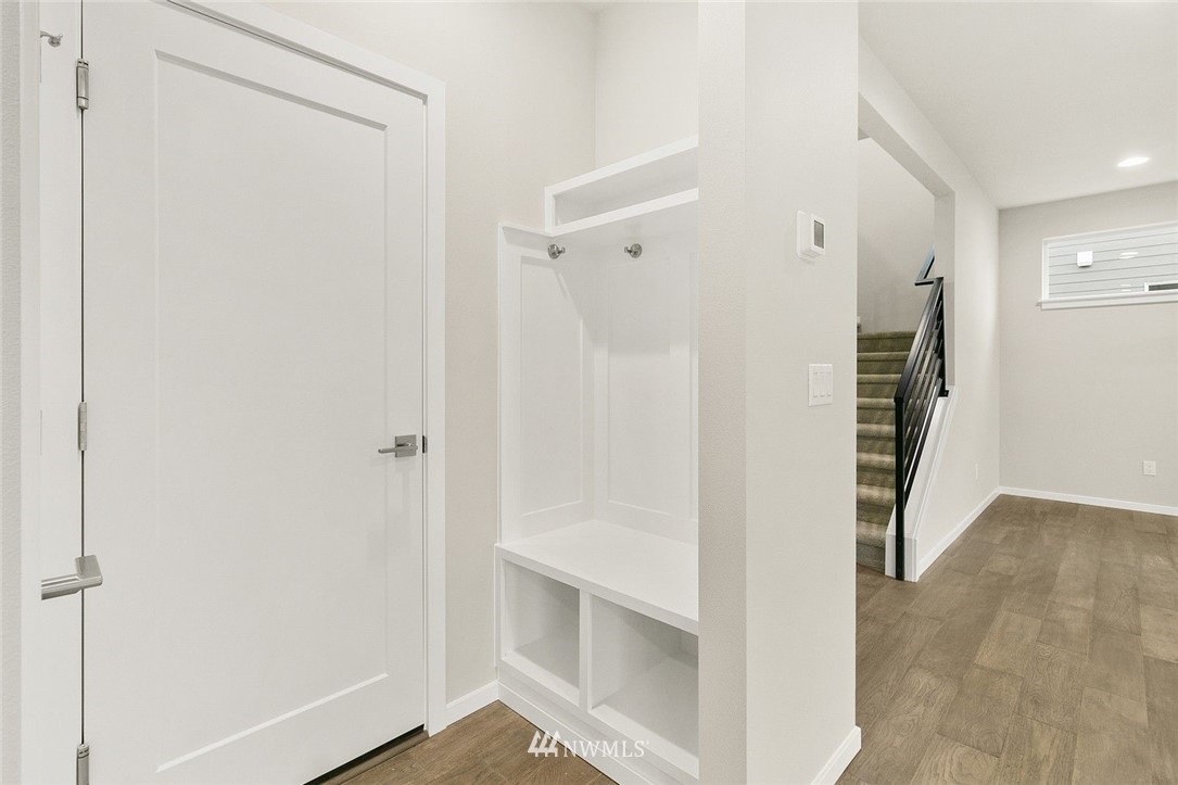 26832 102nd Place Southeast Kent, WA 98030 - Photo 13 of 31 a view of a hallway with wooden floor and entryway