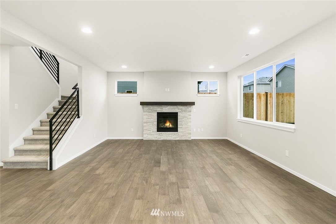 26832 102nd Place Southeast Kent, WA 98030 - Photo 14 of 31 wooden floor in an empty room with a fireplace