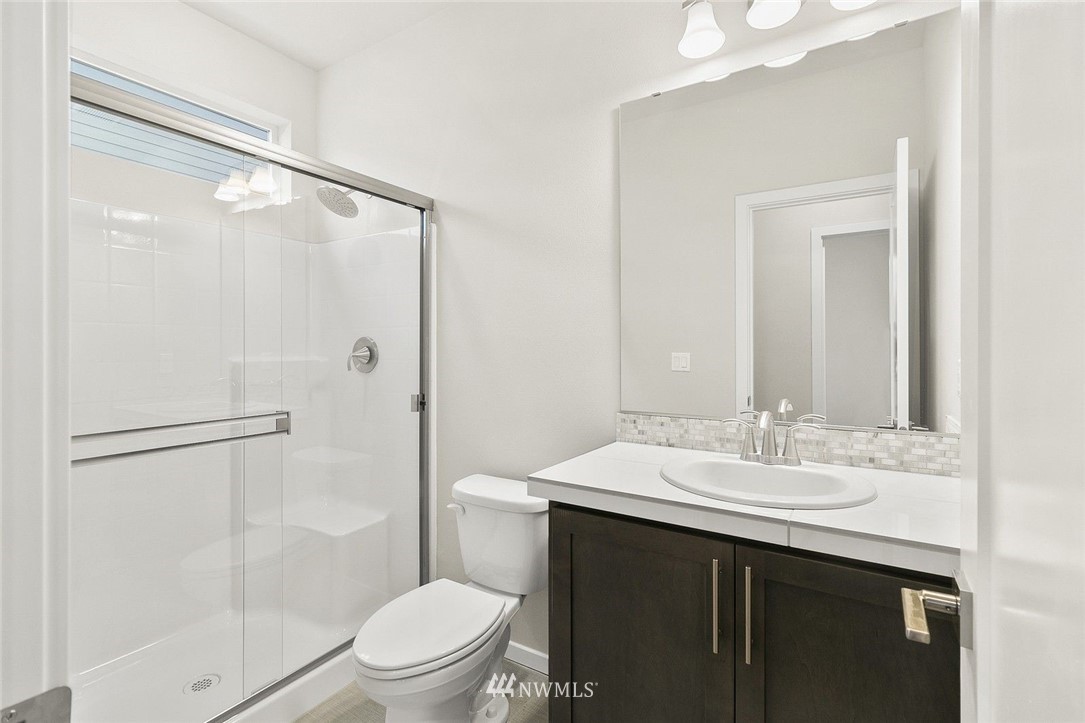 26832 102nd Place Southeast Kent, WA 98030 - Photo 3 of 31 a bathroom with a sink a toilet and shower