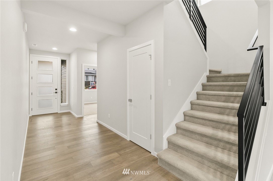 26832 102nd Place Southeast Kent, WA 98030 - Photo 4 of 31 a view of an entryway with wooden floor