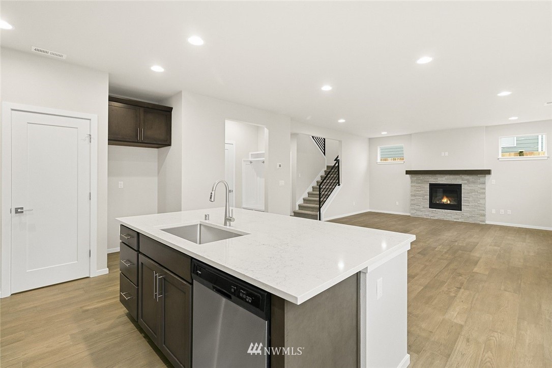 26832 102nd Place Southeast Kent, WA 98030 - Photo 10 of 31 a kitchen with a sink and a fireplace