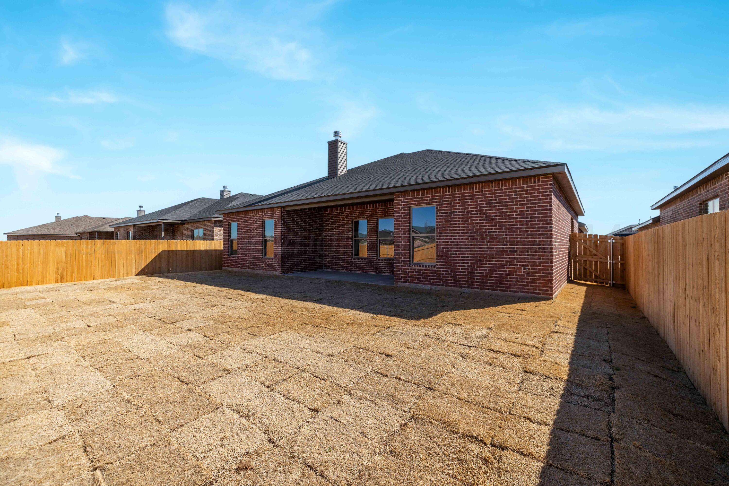 3006 Frontier Lane Amarillo, TX 79124 - Photo 16 of 16 a front view of a house with a yard