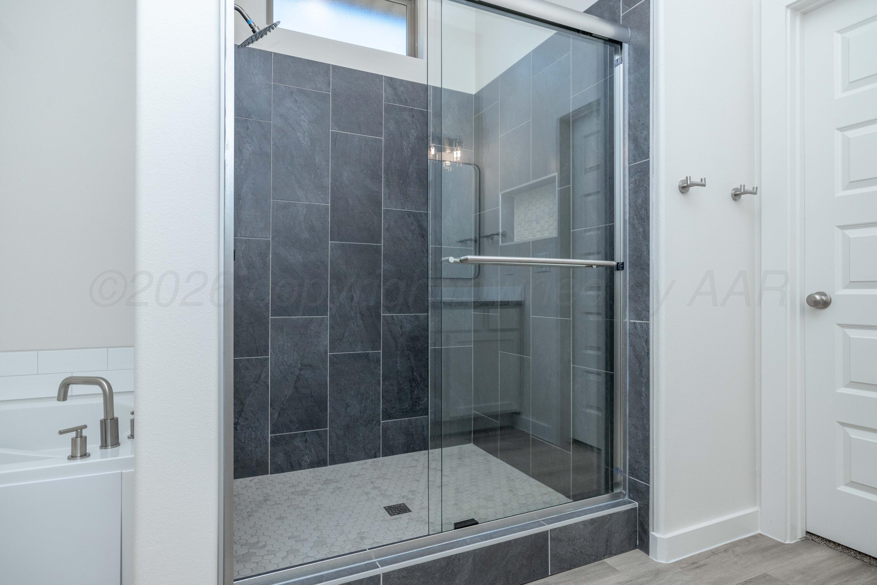3006 Frontier Lane Amarillo, TX 79124 - Photo 7 of 16 a bathroom with a shower
