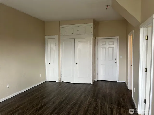 a kitchen with cabinets and white stove