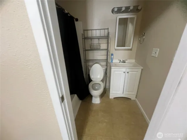 a view of hallway with wooden floor