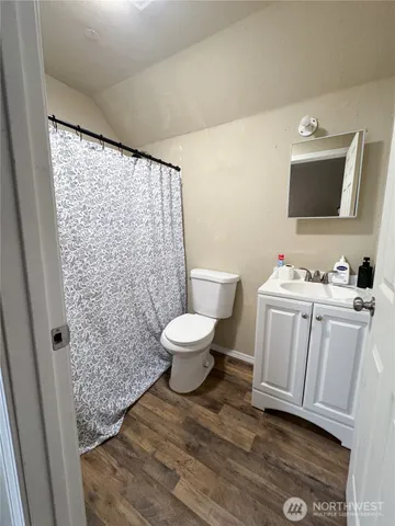 a bed room with a bed and a window