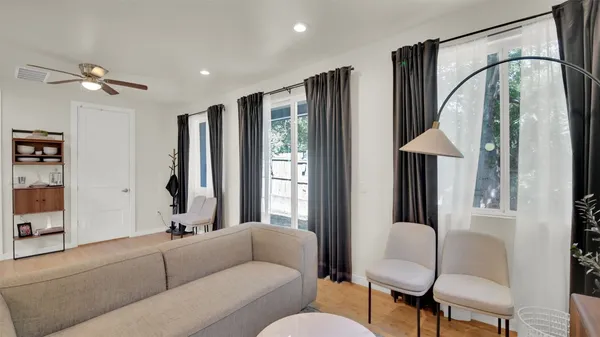 a living room with furniture and a window