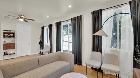 a living room with furniture and a window