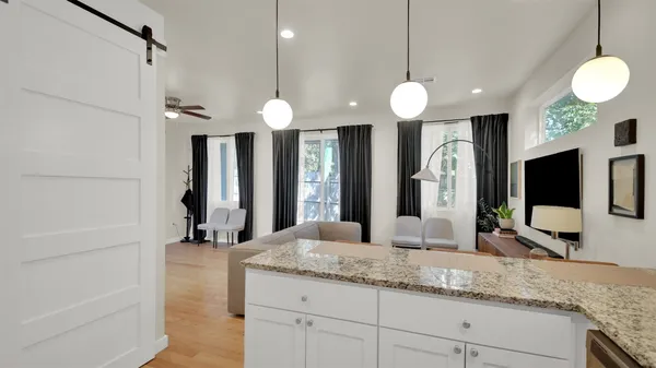 a bathroom with a sink a large mirror and a shower