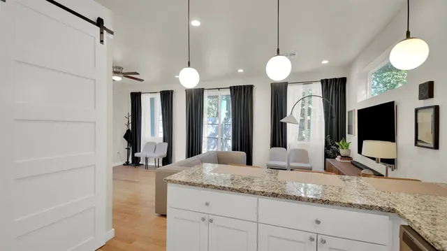 a bathroom with a sink a large mirror and a shower