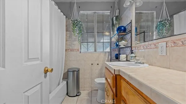 a living room with a bed furniture and a window