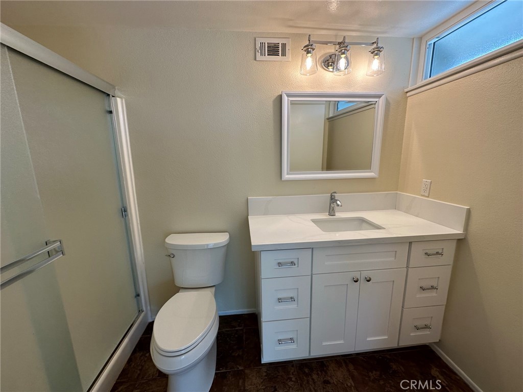 1155 Currier Avenue Simi Valley, CA 93065 - Photo 12 of 15 a bathroom with a toilet sink and mirror