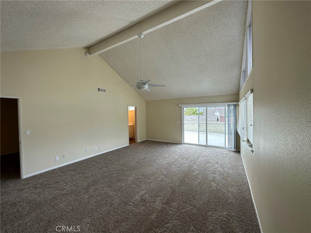 1155 Currier Avenue Simi Valley, CA 93065 - Photo 9 of 15 an empty room with windows and chandelier