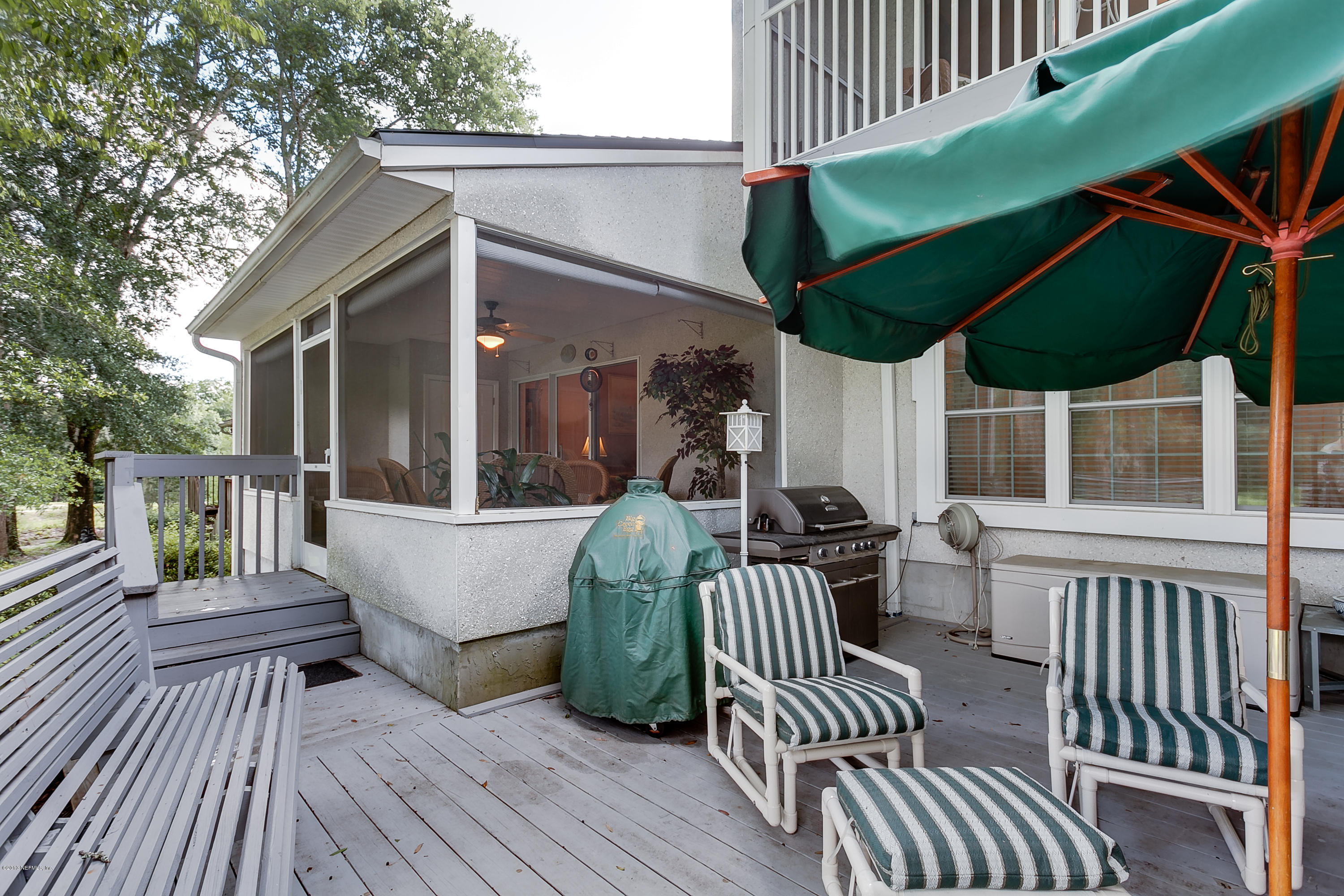 3105 Ravines Road Middleburg, FL 32068 - Photo 12 of 32 a view of a deck with wooden floor and fence